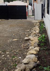 a row of rocks on the side of a road at APARTAMENTOS IPAP LUPERON in Puerto de Luperon