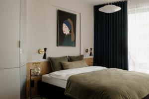 Posteľ alebo postele v izbe v ubytovaní Sage Apartment