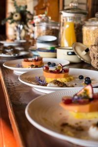 a row of plates of food on a table at Moolmanshoek Private Game Reserve in Fouriesburg