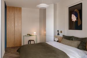 Posteľ alebo postele v izbe v ubytovaní Sage Apartment
