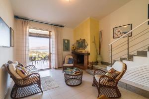 Istumisnurk majutusasutuses Appartement in Stintino mit Grill und Terrasse und Meerblick