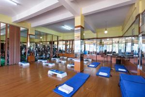 a gym with blue yoga mats in a room at HOTEL NOKRAS (K) LIMITED in Murangʼa