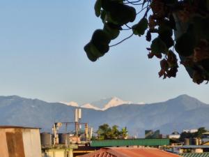 a view of mountains in the background of a city at FAITH in Siliguri