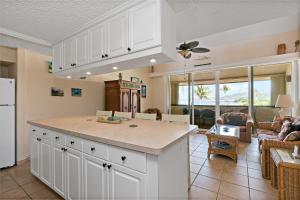 a kitchen with a large island in a living room at Another Beautiful Day In Paradise in Christiansted
