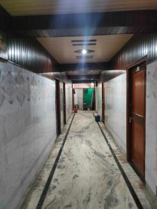 an empty hallway in a building under construction at SGH Guest House in Mathura