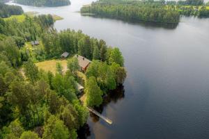 an aerial view of a house on an island in a lake at Ahoniemi - Kellankoski in Rossi