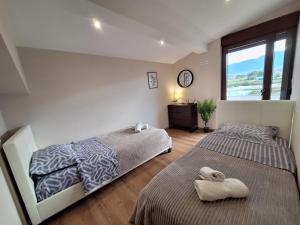 Letto o letti in una camera di Luxury suite with sea and Olympus view