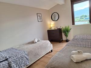 Letto o letti in una camera di Luxury suite with sea and Olympus view