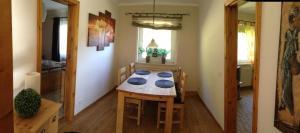 a room with a table and a dining room at Ferienhaus für 5 Personen ca 70 qm in Sankt Andreasberg, Harz Oberharz in Sankt Andreasberg