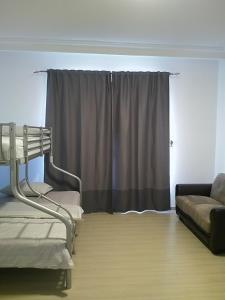 a living room with a couch and a window at Saraya Al Olaya Tower family house in Al Khobar +22 photos