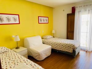 Postel nebo postele na pokoji v ubytování Casa da Bélgica