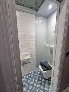 a small bathroom with a toilet and a sink at Garden Barn Studio, sleeps 3 in Heath and Reach