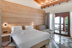 A bed or beds in a room at Z Inn Ioannina