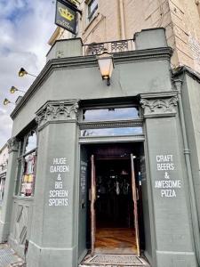 an entrance to a store with the door open at The Crown Rooms in London