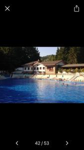 a picture of a house and a swimming pool at Via Degli Dei Valserena in San Benedetto Val di Sambro
