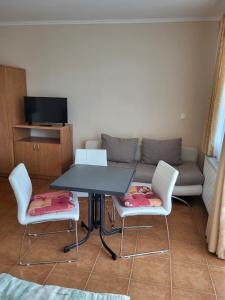 Televízia a/alebo spoločenská miestnosť v ubytovaní Tip-Top Apartmenthouse