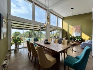 a dining room with a table and chairs at Wayra Natura in Circasia