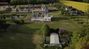 an aerial view of a large estate with a large house at Domaine de la Vaudourière in Lunay