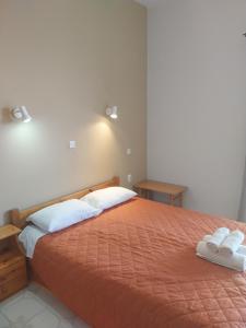 Säng eller sängar i ett rum på Meltemi Rooms and Apartments