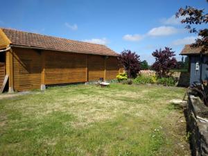 a large yard in front of a building at Gite de Tournieres in Tournières