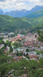 a city with a river and a town with mountains at Apartman stan Konjic in Konjic