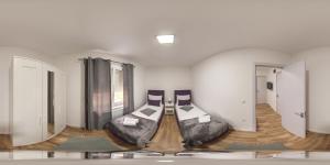 a room with two beds in a room with at Apartman Mina 4 in Vrdnik