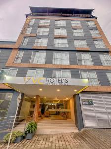 a building with a hotel sign in front of it at VVC Hotel's in Villavicencio