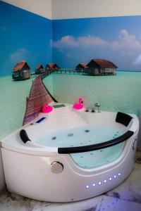 a bath tub in the middle of the water with a resort at Hot Jacuzzi in Cracow in Kraków