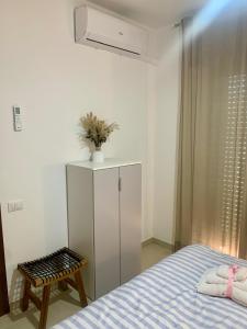 Postel nebo postele na pokoji v ubytování Vitti Apartment