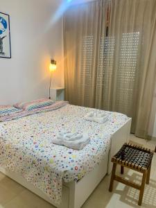 Postel nebo postele na pokoji v ubytování Vitti Apartment