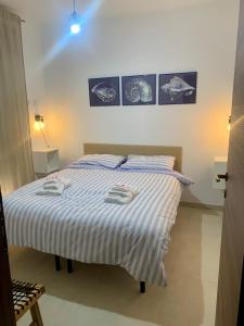 Postel nebo postele na pokoji v ubytování Vitti Apartment