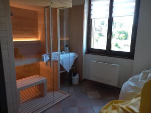 Postel nebo postele na pokoji v ubytování Antico Borgo Carceri & Wellness
