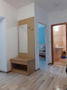 a bathroom with a mirror and a sink in a room at Двустаен апартамент в Приморско in Primorsko +38 photos