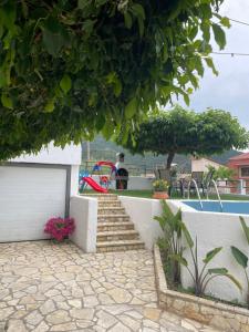 a set of stairs leading to a playground at Areti's Home in Igoumenitsa