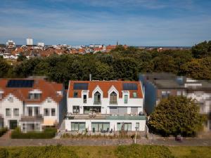 an aerial view of a house in a city at Quartier M12 in Norderney