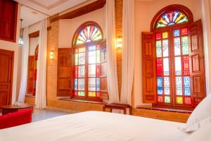 Ένα ή περισσότερα κρεβάτια σε δωμάτιο στο Riad Al Ansari