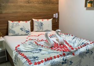 Cama ou camas em um quarto em Pousada Beija Flor