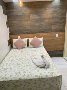 Cama ou camas em um quarto em Pousada Beija Flor