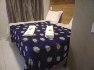 Cama ou camas em um quarto em Pousada Beija Flor