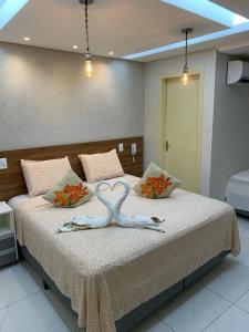 Cama ou camas em um quarto em Pousada Beija Flor