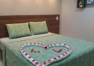 Cama ou camas em um quarto em Pousada Beija Flor