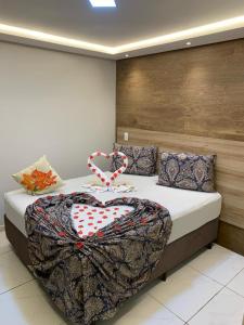Cama ou camas em um quarto em Pousada Beija Flor