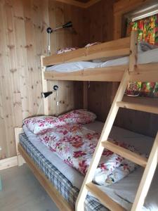 a couple of bunk beds in a room at Villa Fjara in Ulven