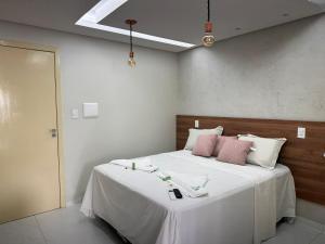 Cama ou camas em um quarto em Pousada Beija Flor