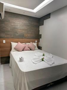 Cama ou camas em um quarto em Pousada Beija Flor