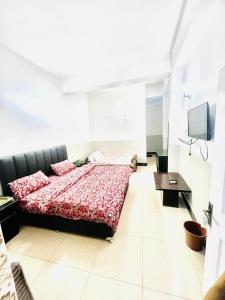 TV a/nebo společenská místnost v ubytování Paradise Rain Hotel