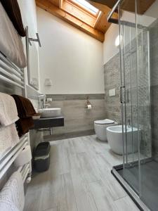 a bathroom with two sinks and a shower at Locanda B&B Da Nati in Arba +48 photos