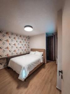 Postel nebo postele na pokoji v ubytování Iris Apartment Livadeia