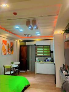 a room with a kitchen and a dining room at Oppas Studio Unit near Sm uptown in Cagayan de Oro