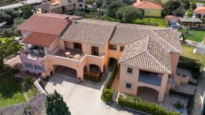 an aerial view of a house with a roof at Acquarello Rooms in San Teodoro